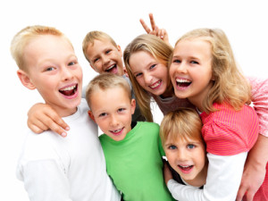 Closeup portrait of a young boys and girls smiling isolated on white background